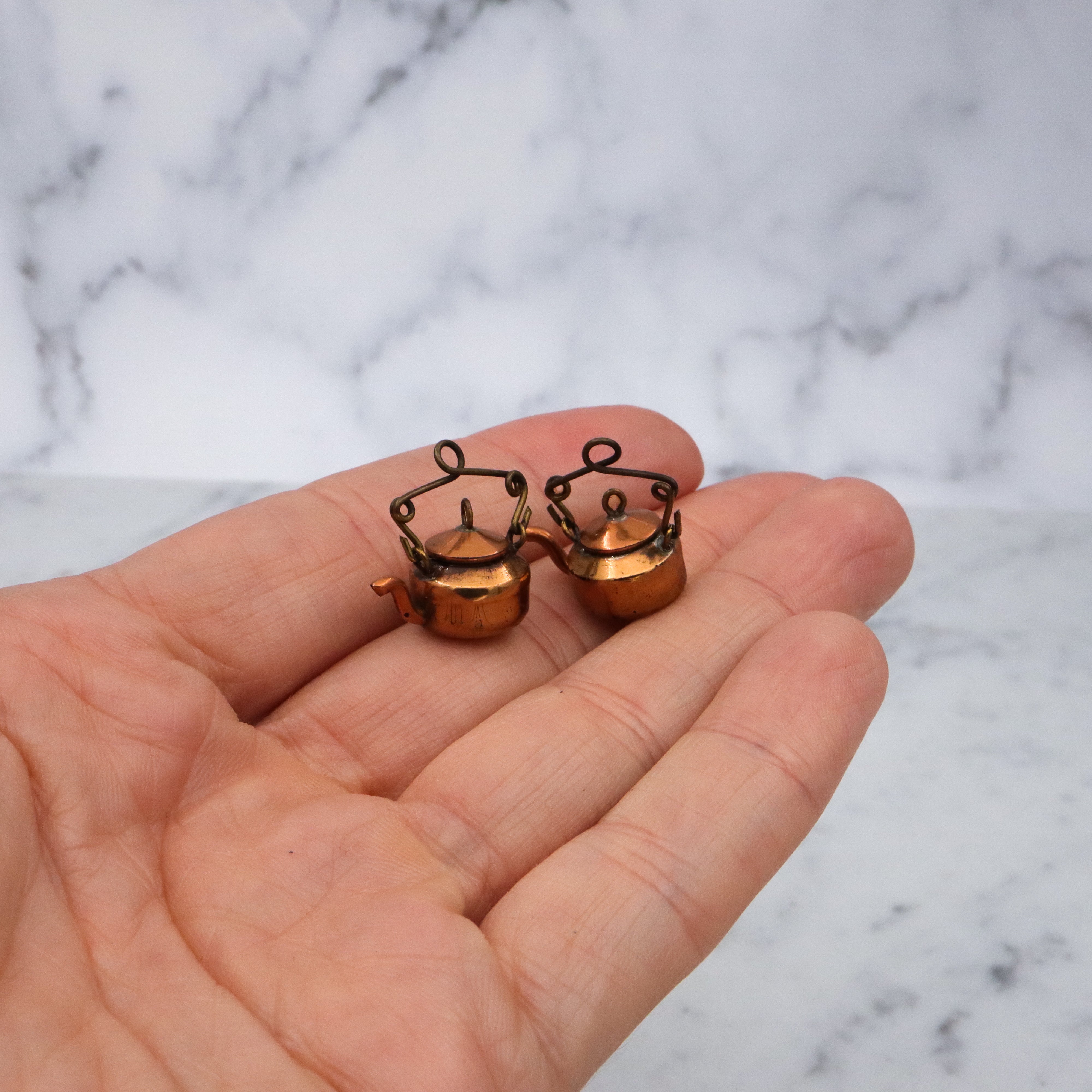 Pair of antique early 20th century prisoner made wheat penny copper tea kettles